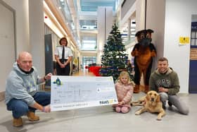 Isla Porri and her family visited Durham Constabulary HQ to present the Paws Up charity with the money she raised through her sponsored walk.