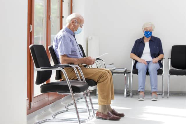 A generic stock photo of people in a hospital waiting room.