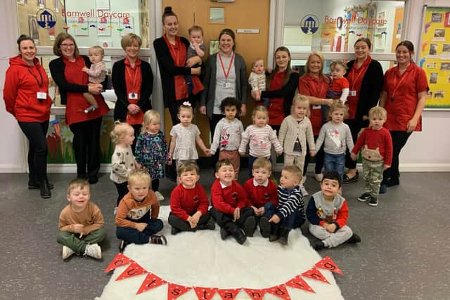 Staff and students at Barnwell Academy Daycare nursery celebrate their outstanding Ofsted inspection.