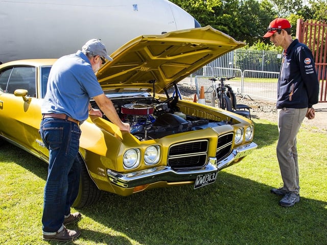 Neil Engward and Ian Taylor look enthusiastically at the 1971 Pontiac LeMans.