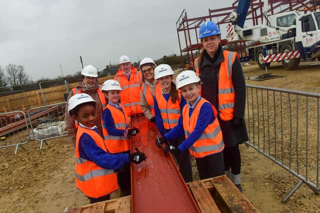 Pupils at Hetton Primary School signing a steel girder to be used in the construction of their new school. (left to right) Sunderland City Councillor Claire Rowntree, Gary Hope Regional MD Robertson Construction, Sunderland City Councillor Louise Farthing and Headteacher Nicola Hill.

Photograph: Kevin Brady