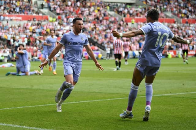 Jack Harrison of Leeds United celebrates with teammate Raphinha after scoring their side's second goal during the Premier League match between Brentford and Leeds United at Brentford Community Stadium on May 22, 2022 in Brentford, England. (Photo by Alex Davidson/Getty Images)