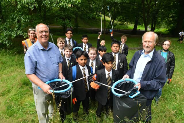 Last year St Aidan's Catholic Academy pupil take part in a clean up of Blackhouse Park with Coun Michael Dixon and Coun Peter Wood (R)