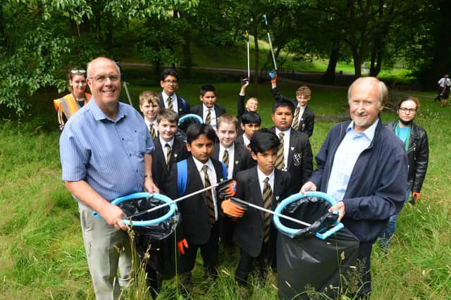 Last year St Aidan's Catholic Academy pupil take part in a clean up of Blackhouse Park with Coun Michael Dixon and Coun Peter Wood (R)