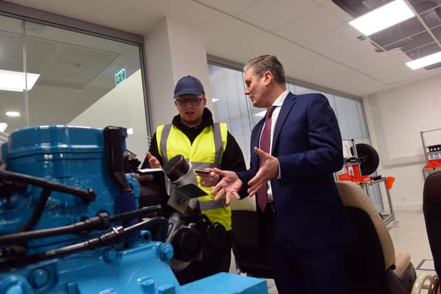 Labour leader Sir Keir Starmer chatting with a youngster in the engineering workshop at the Beacon of Light.