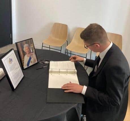 Cllr Josh McKeith signing the book of condolences at the City Hall in Sunderland.