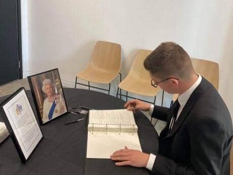 Cllr Josh McKeith signing the book of condolences at the City Hall in Sunderland.