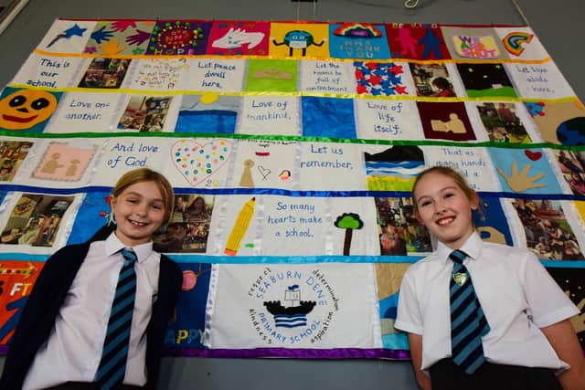 Ava Reynolds (left) ,10, and Isabella Sloanes, 9, following the unveiling of the lockdown quilt at Seaburn Dene Primary School.