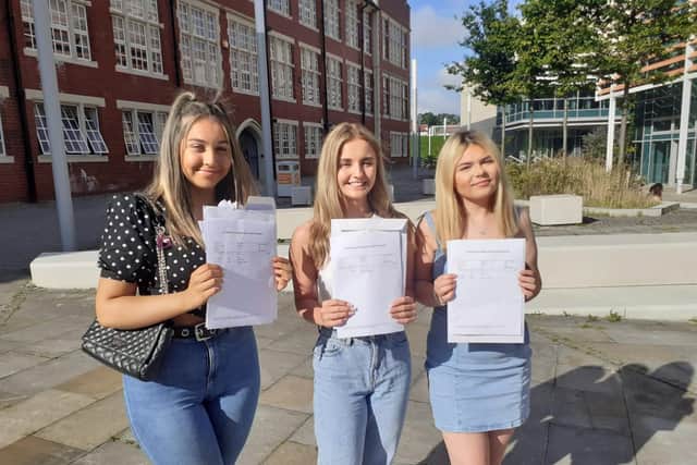 Ellie Murray, 18, (right) celebrates receiving her A Level grades alongside friends Tia Anderson, 18 (centre), and Caitlin Copeland, 18.