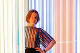 Artist Liz West pictured in front of her artwork, Our Spectral Vision, currently on display at The Light.