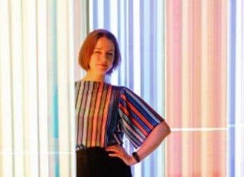 Artist Liz West pictured in front of her artwork, Our Spectral Vision, currently on display at The Light.