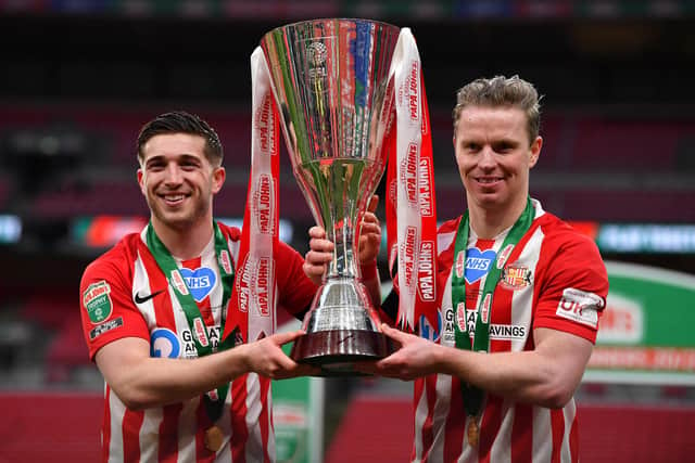 Lynden Gooch and Grant Leadbitter pose with the trophy after winning the Papa John's Trophy Final match between Sunderland and Tranmere Rovers.