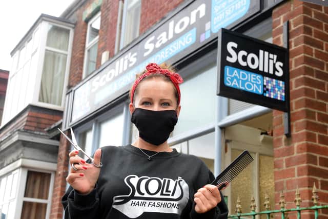 As well as wearing face masks and "sterilising everything", Scolli's staff will change barber capes for each new customer. Picture by Stu Norton.