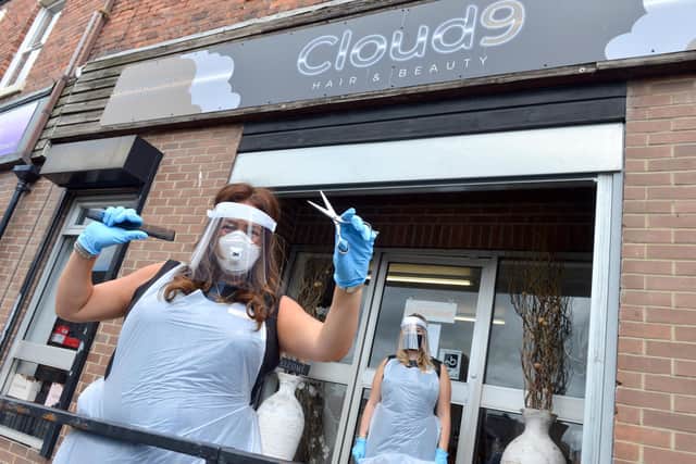 Cloud 9 Hair & Beauty owner Debra Ann Adamson (L) with staff member Caitlin Trotter ahead of their midnight reopening.