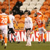 Jerry Yates of Blackpool celebrates with Kenny Dougall after scoring their side's second goal from the penalty spot against Peterborough.