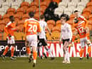 Jerry Yates of Blackpool celebrates with Kenny Dougall after scoring their side's second goal from the penalty spot against Peterborough.