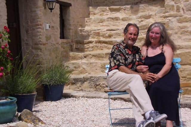 Greg and Sandra on the steps of their Italian home.