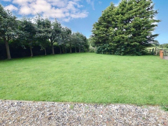 The property includes lawned gardens.