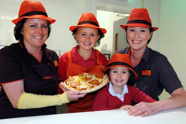 Plains Farm Primary School pupil Milly Nicholson won a pizza-making competition and her prize was a visit to Sainsbury's in Silksworth Lane  to highlight the new pizza service. Here she is with younger sister Ava and pizza staff Alison Hilton and Tracey Best in 2011.