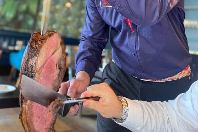 Gaucho chefs carve the meats at your table