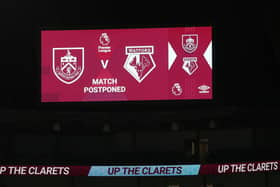 A message is seen on the LED board saying the match is called off prior to the Premier League match between Burnley and Watford at Turf Moor. (Photo by Jan Kruger/Getty Images)