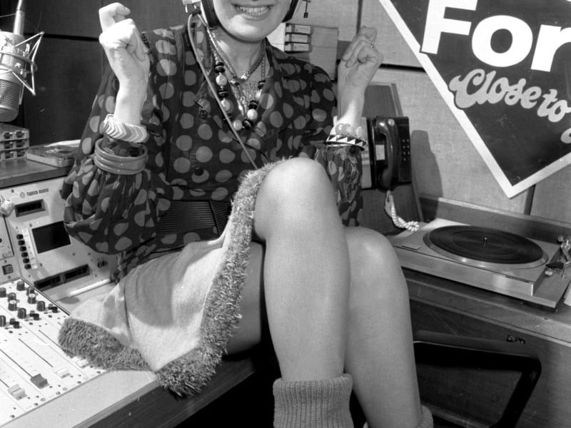 British TV and stage actress Su Pollard wearing headphones on a trip to Radio Forth studios in Forth Street Edinburgh, December 1986.