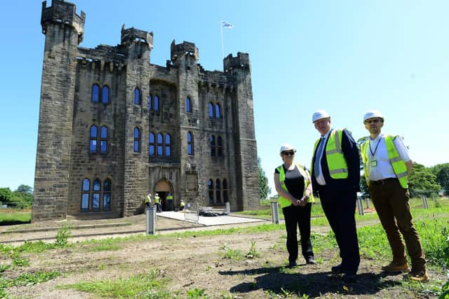 John Kelly with Councilor Doris McKnight and Jon Charlton, project director, as work pressed ahead on Hylton Castle