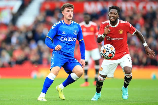 Everton's Welsh midfielder Nathan Broadhead vies with Manchester United's Brazilian midfielder Fred during the pre-season friendly football match between Manchester United and Everton at Old Trafford in Manchester, north west England, on August 7, 2021. (Photo by LINDSEY PARNABY/AFP via Getty Images)