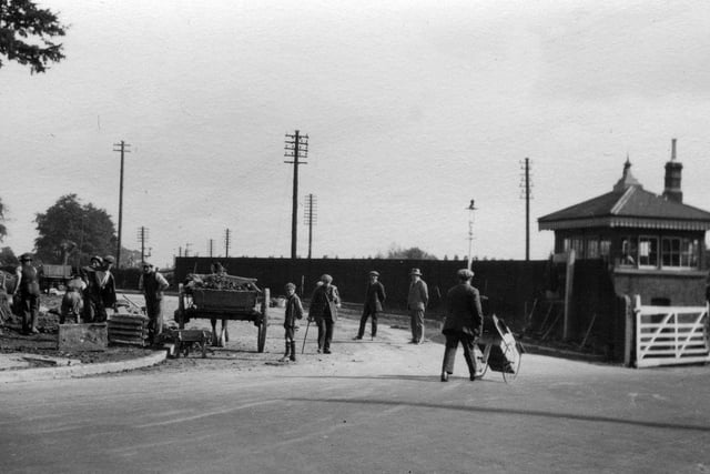 Local labour working on the junction early years of the last century. To the left and just out of sight were two railwaymen-owned houses. These were rented by the signalmen who worked in the signal box to the right.  Picture: Paul Costen collection