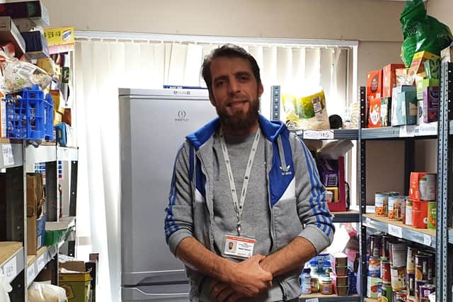Abdulsalam Alkhalid is volunteering at his local food bank.