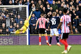 Anthony Patterson makes a fine save at Millwall
