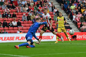Sunderland goalkeeper Thorben Hoffmann makes a double save against Bolton.