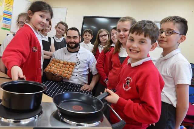 St Paul's CE Primary School pupils get a lesson in cooking from The Alexandra Steakhouse chef Geoff Rutherford 
