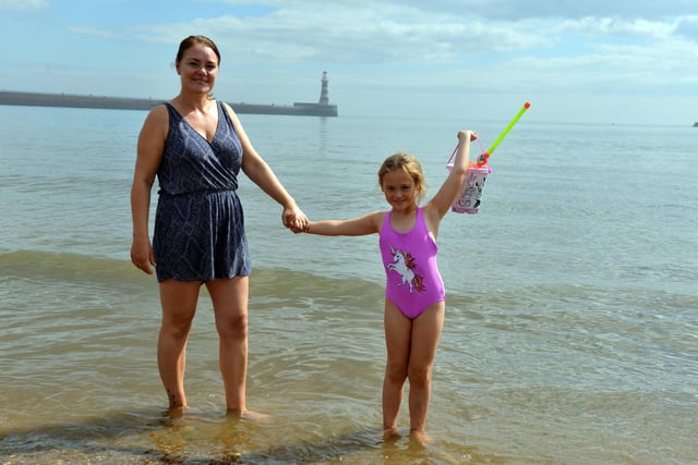 Vicki Owens and daughter Jenny, six, cool off at Roker during the heatwave
