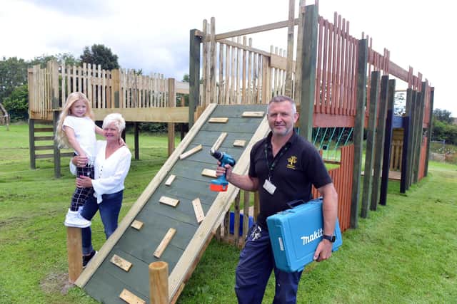 The Ribbon Academy Trust donation from gran Angie Crosbie following the theft of materials to build a structure for the children. With granddaughter Patience Crosbie, eight, and the school's site manager John Murray