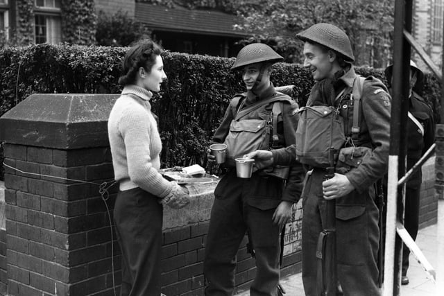 Home Guards take time out of training for a cuppa in 1942.