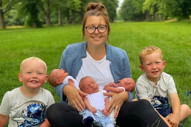 Mum Amy Lindsay with the identical triplets and brothers Elijah, 4, and Zion, 2.