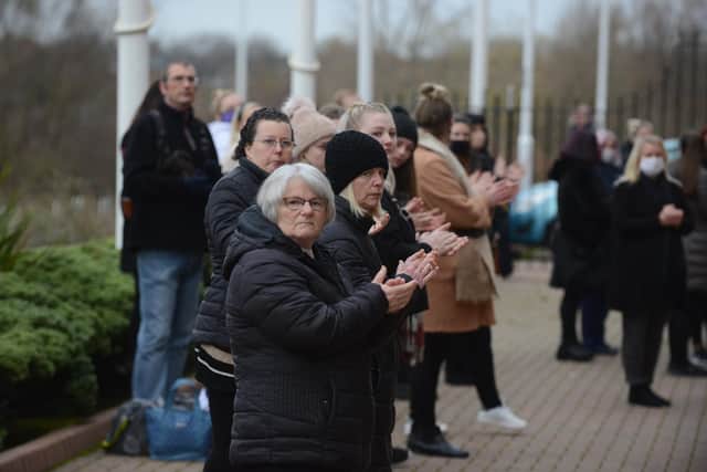 Familly and friends gather for the funeral of Dean Matthews as it passes the Stadium of Light.