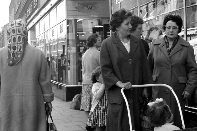 Outside Woolworths in John Street. A bit of window shopping for these 1963 customers.