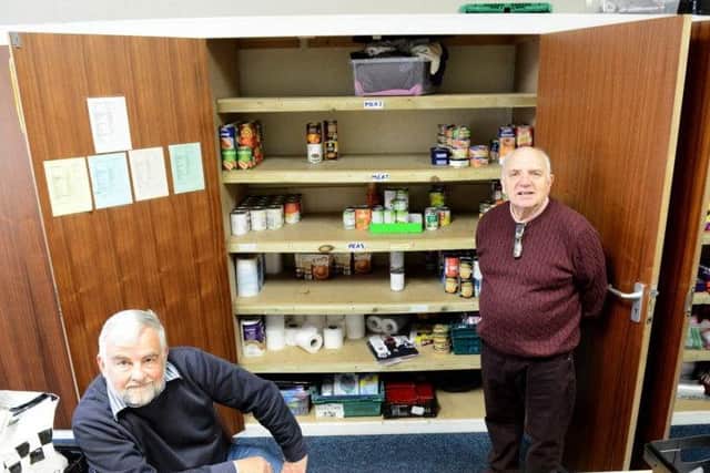Granville Hawkins (right) with Elim Church Foodbank volunteer Dave Smith at Elim food bank
