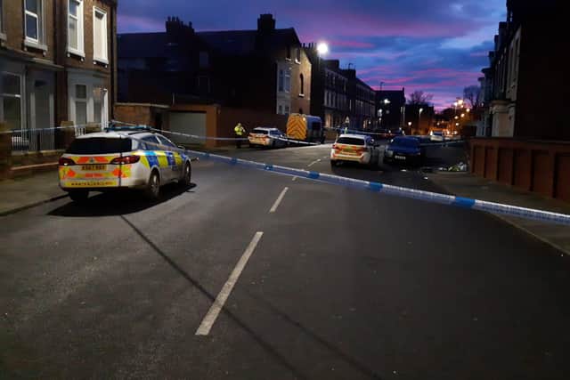 A number of police vehicles are at the scene following an "altercation" on Gray Road in Hendon.