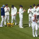 Durham bowler Chris Rushworth is congratulated by captain Scott Borthwick (r) and team-mates after taking the wicket of Worcestershire batsman Jack Haynes for his 528th first class wicket for Durham, beating the previous record set by Graham Onions.