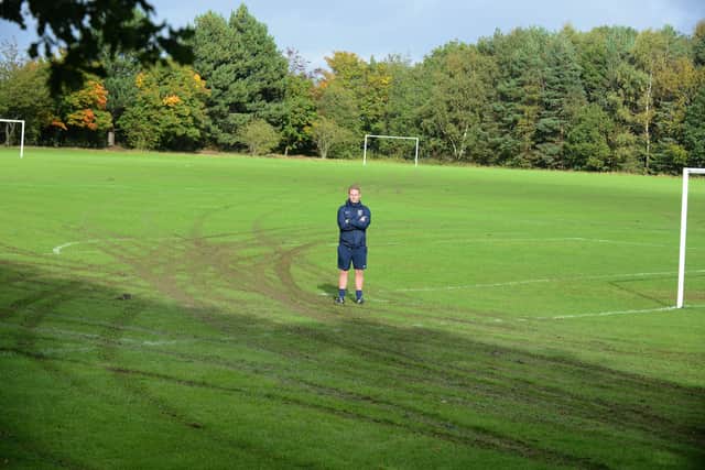 Gary Sykes pictured with the damage to the pitches.