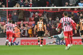 Amad scores from the penalty spot against Hull City.