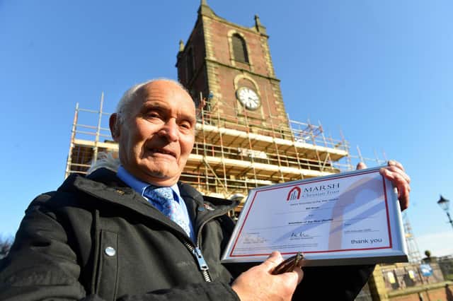 Holy Trinity Church volunteer William Dove with his award for his devotion to the church.