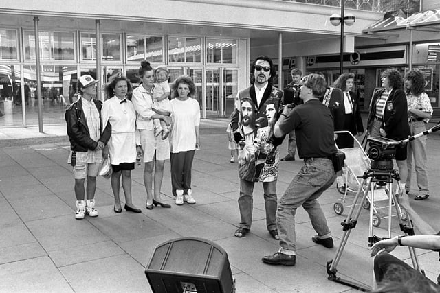 Wearside rock star Dave Stewart surprised Sunderland shoppers by performing songs from his new album in the town's Market Square in 1990.