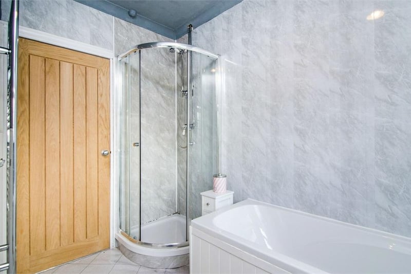 The family bathroom comprises of a bath, shower cubicle, toilet, hand basin and heated towel rail