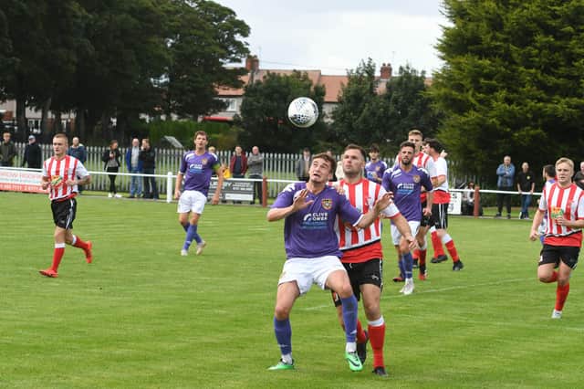 Sunderland RCA (red/white) v Ryhope CW (purple) at Meadow Park, Ryhope, on Saturday.