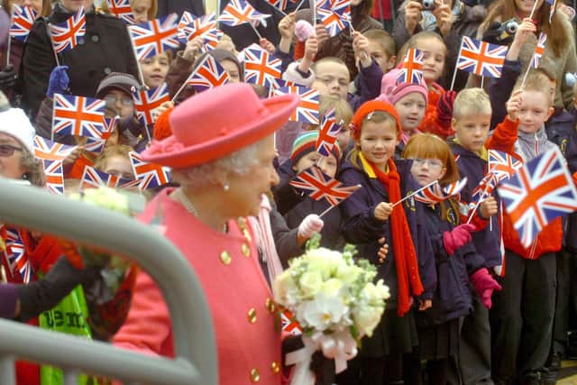 The Queen in Sunderland with the flowers given to her by Lois.