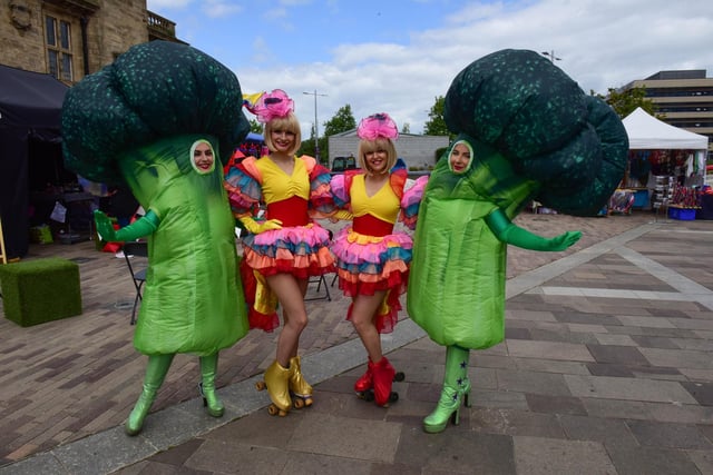 Two people dressed as giant broccoli at the Souled Out festival.
